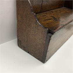 George III oak spoon rack and candle box, the rectangular backplate with shaped  pediment and two six aperture spoon racks, above a candlebox with hinged cover, with various brass spoons and a pair of brass candle snuffers, H56.5cm, W35cm, D14cm 