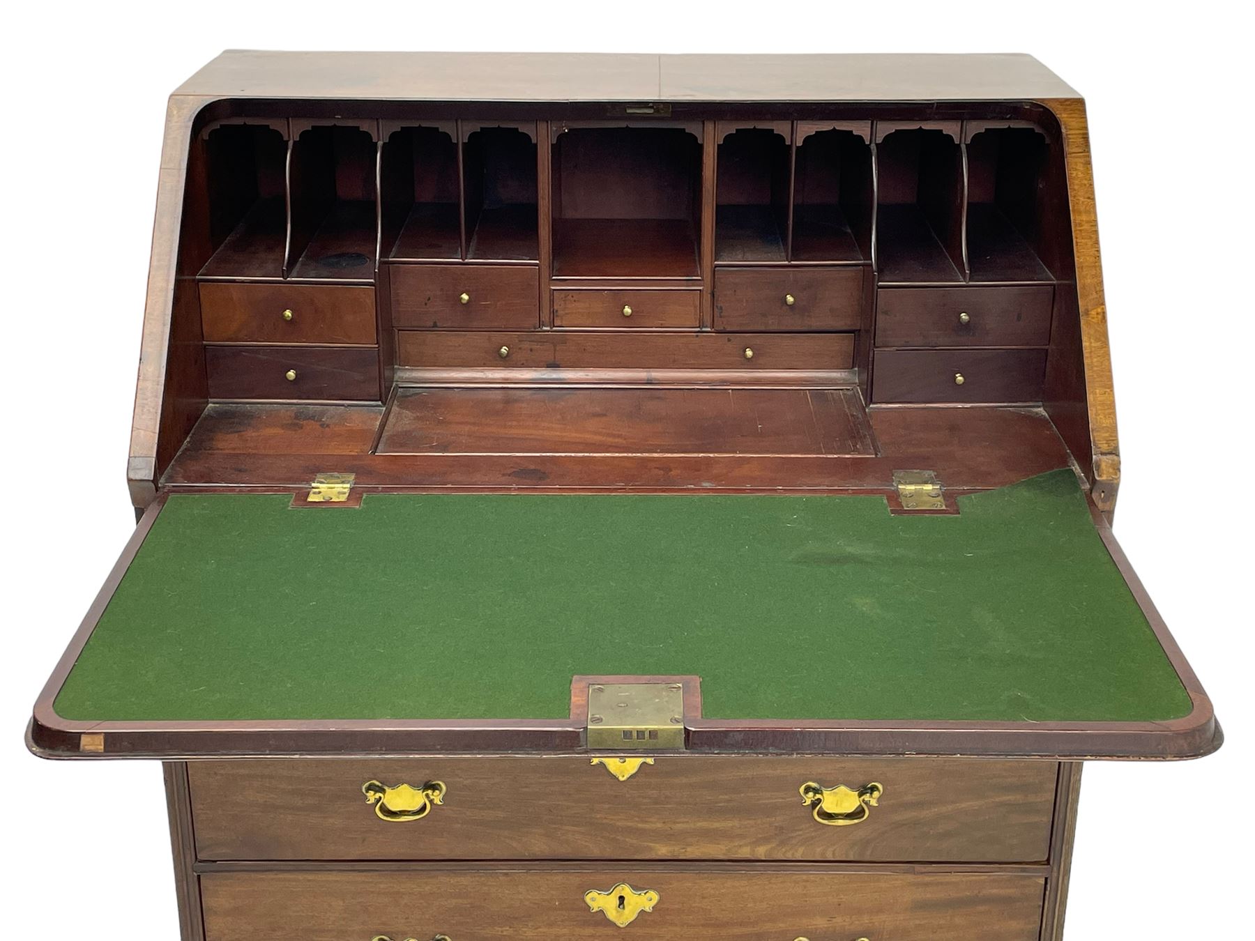 Georgian red walnut and mahogany bureau, moulded rectangular fall front with rounded upper corners, the interior fitted with sliding storage well, a combination of small drawers and pigeons holes, two short and two long drawers below, on bracket feet