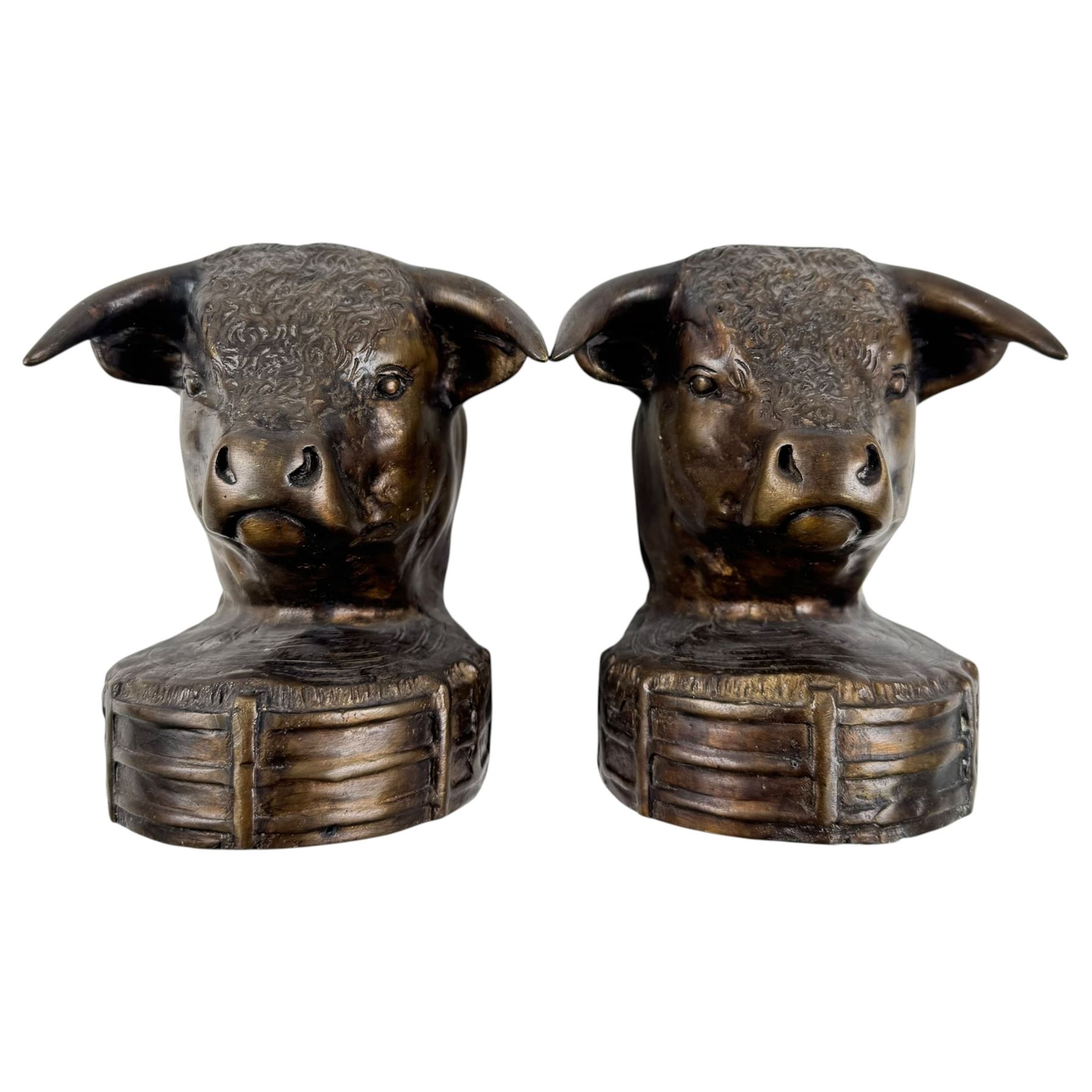 Brass bookends modelled as bulls, together with brass hose and three others 