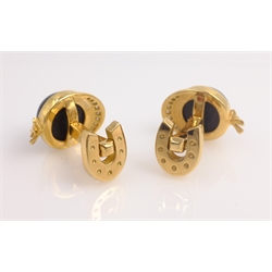  Pair of Piaget 18ct gold diamond and black onyx cuff-links, racing jockey cap design, stamped Piaget 1993 750  