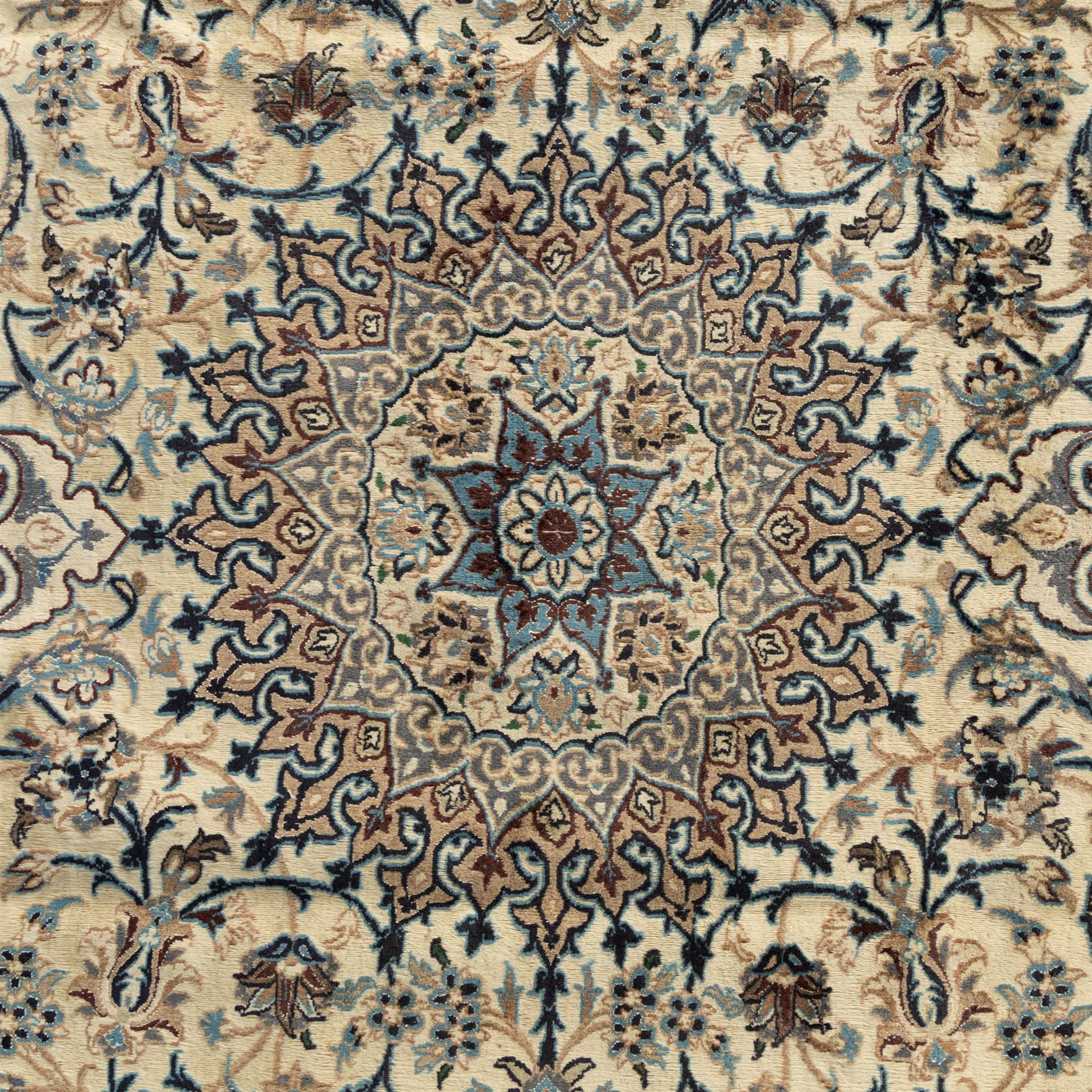Persian Nain carpet, ivory field with concentric medallion in shades of blue and beige, surrounded by scrolling vines, palmettes and floral sprays, enclosed by multiple borders with intricate foliate motifs, originating from the Nain region of central Iran