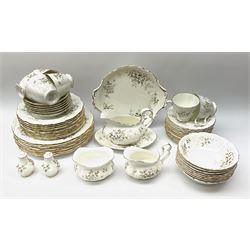 Royal Albert Haworth pattern tea and dinner wares, comprising eight dinner plates, ten salad plates, fourteen side plates, eight bowls, sauce boat and stand, pair of cruets, six tea cups and six saucers, cream jug, open sucrier, and cake plate. 