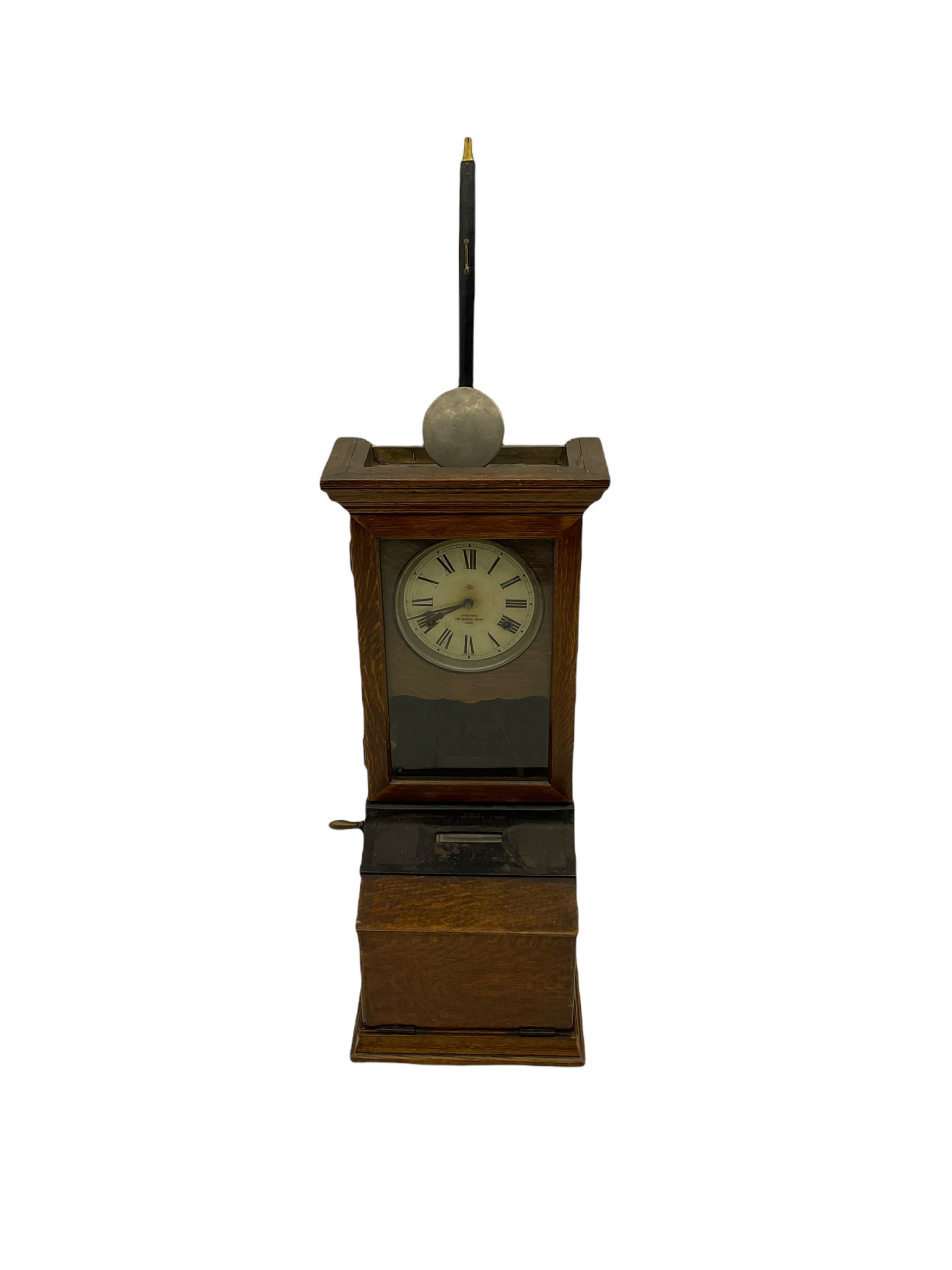 An early 20th century time recording clock (clocking in machine