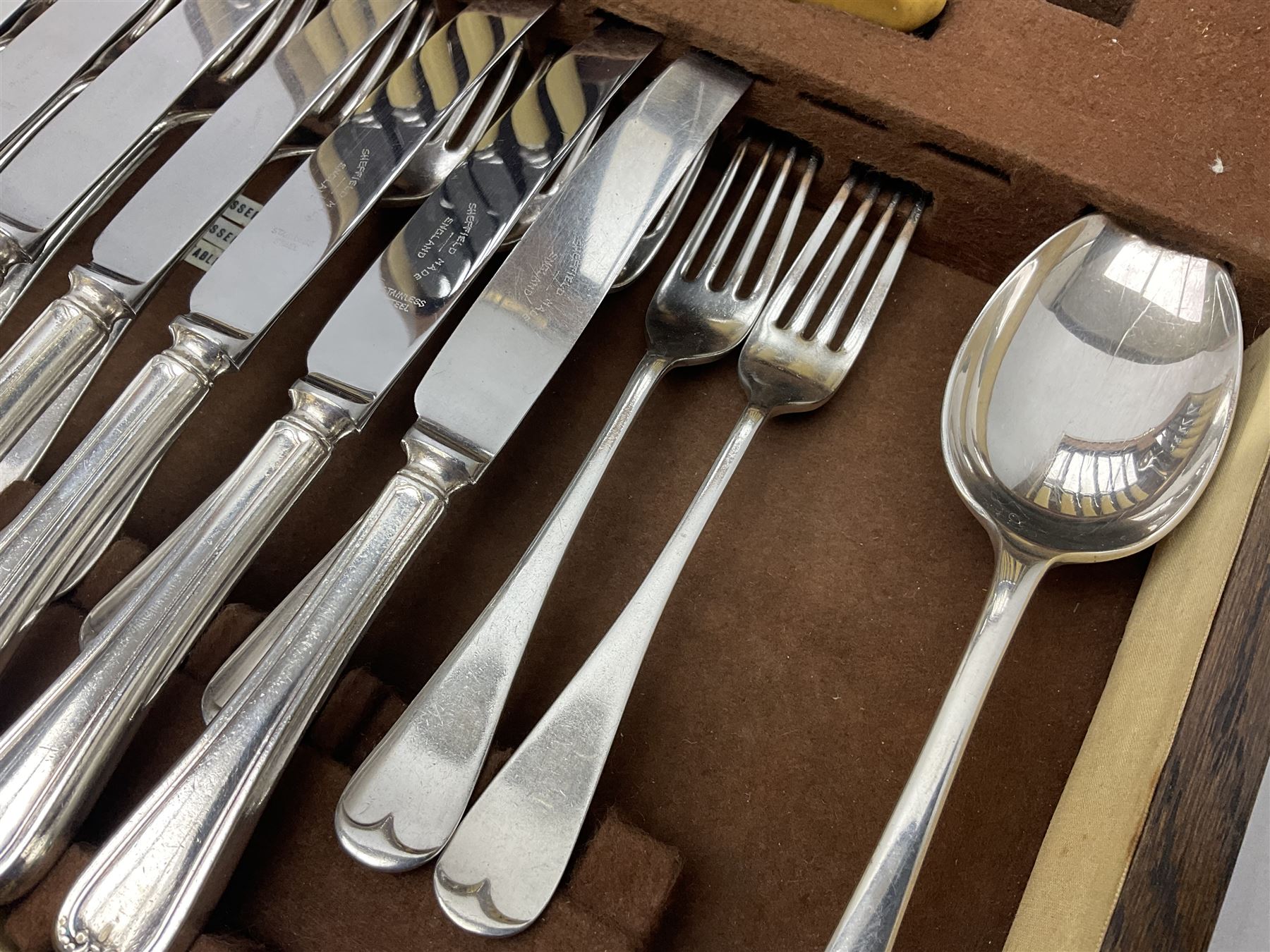 Twelve place setting canteen of cutlery by Lee & Wigfull Ltd, cased in an oak  chest, with key, meat carvers are missing, H18cm, L44cm 