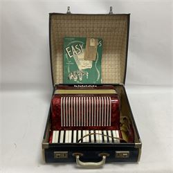 German Hohner student II compact accordion with 26 keys and 12 bass registers in a hard case With tutor
