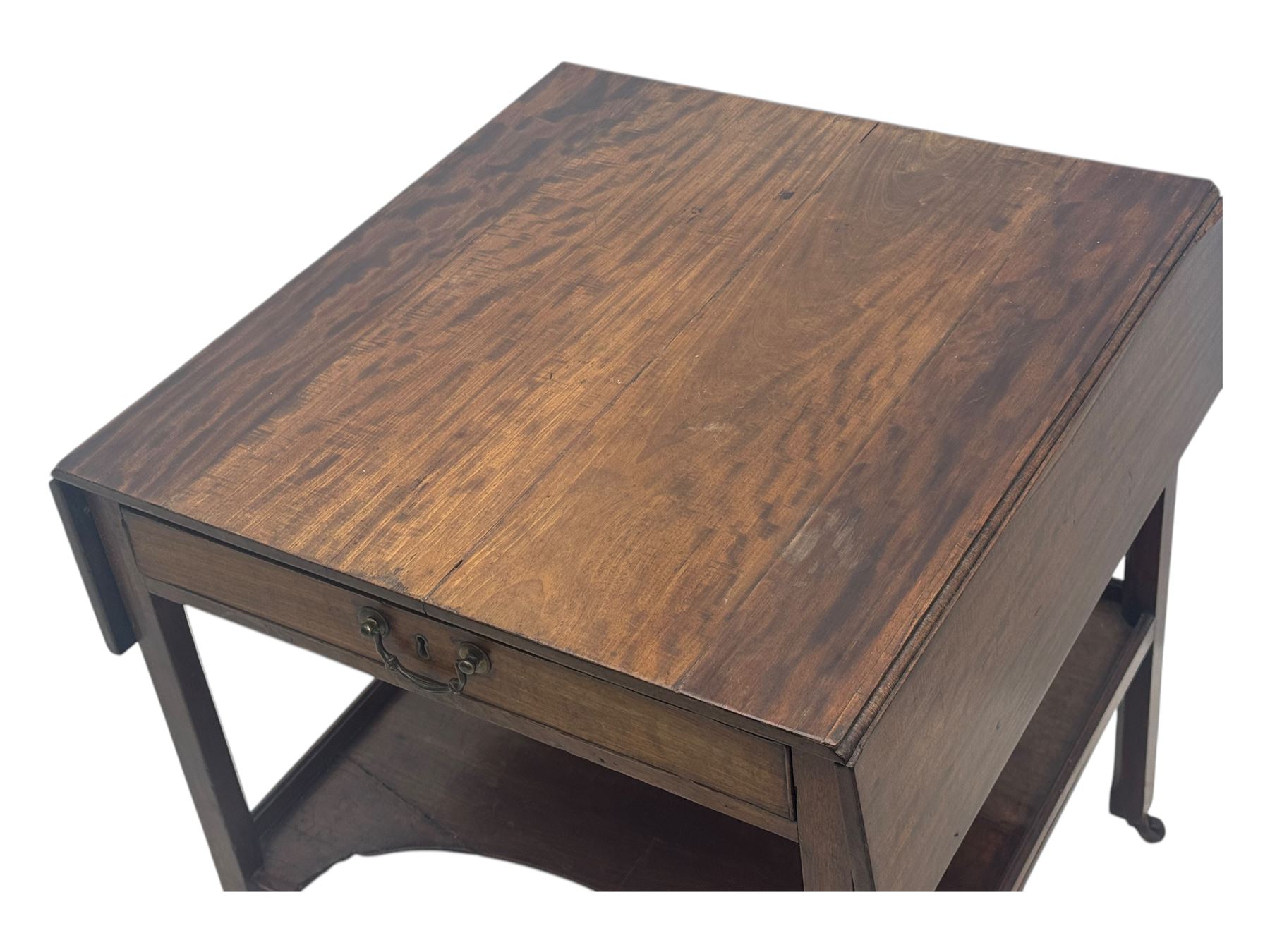 Georgian design mahogany drop-leaf table, rectangular top above a single drawer with brass handle, square supports united by arched undertier, on brass castors (W62cm, D65cm, H72cm); and a smaller mahogany drop-leaf table with single drawer on turned supports (W43cm, D61cm, H72cm)