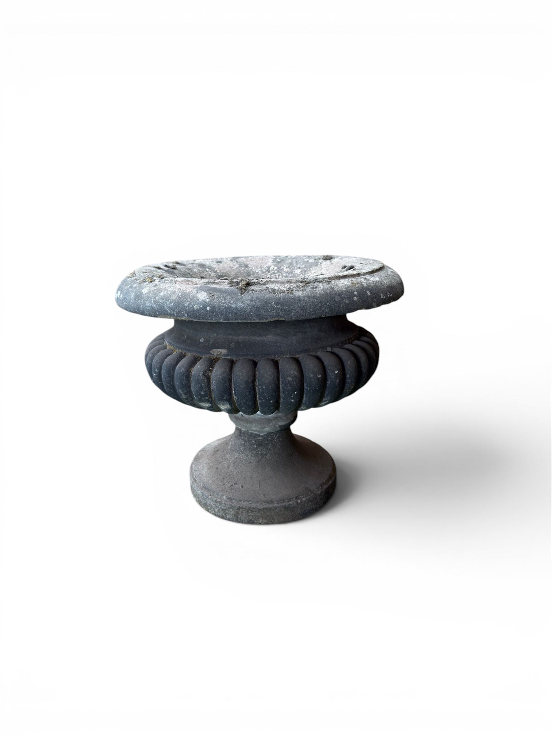 Carved sandstone garden urn, gadrooned campana form