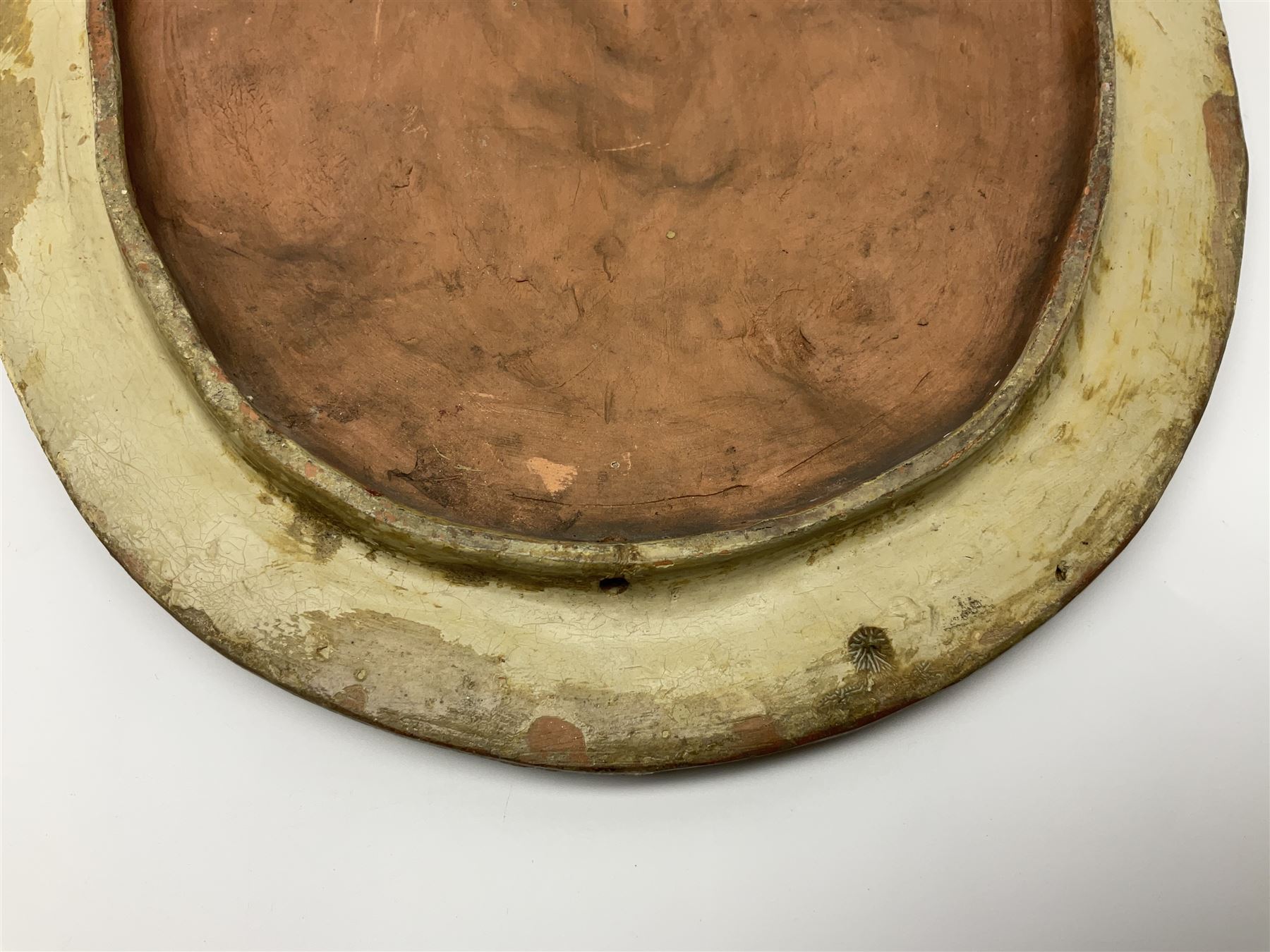 Pair of 19th century classical terracotta relief wall plaques depicting the goddess Hygeia and another goddess, seated holding an ewer, each of oval form, indistinctly signed, each stamped Ferreira verso, H42cm, W30cm