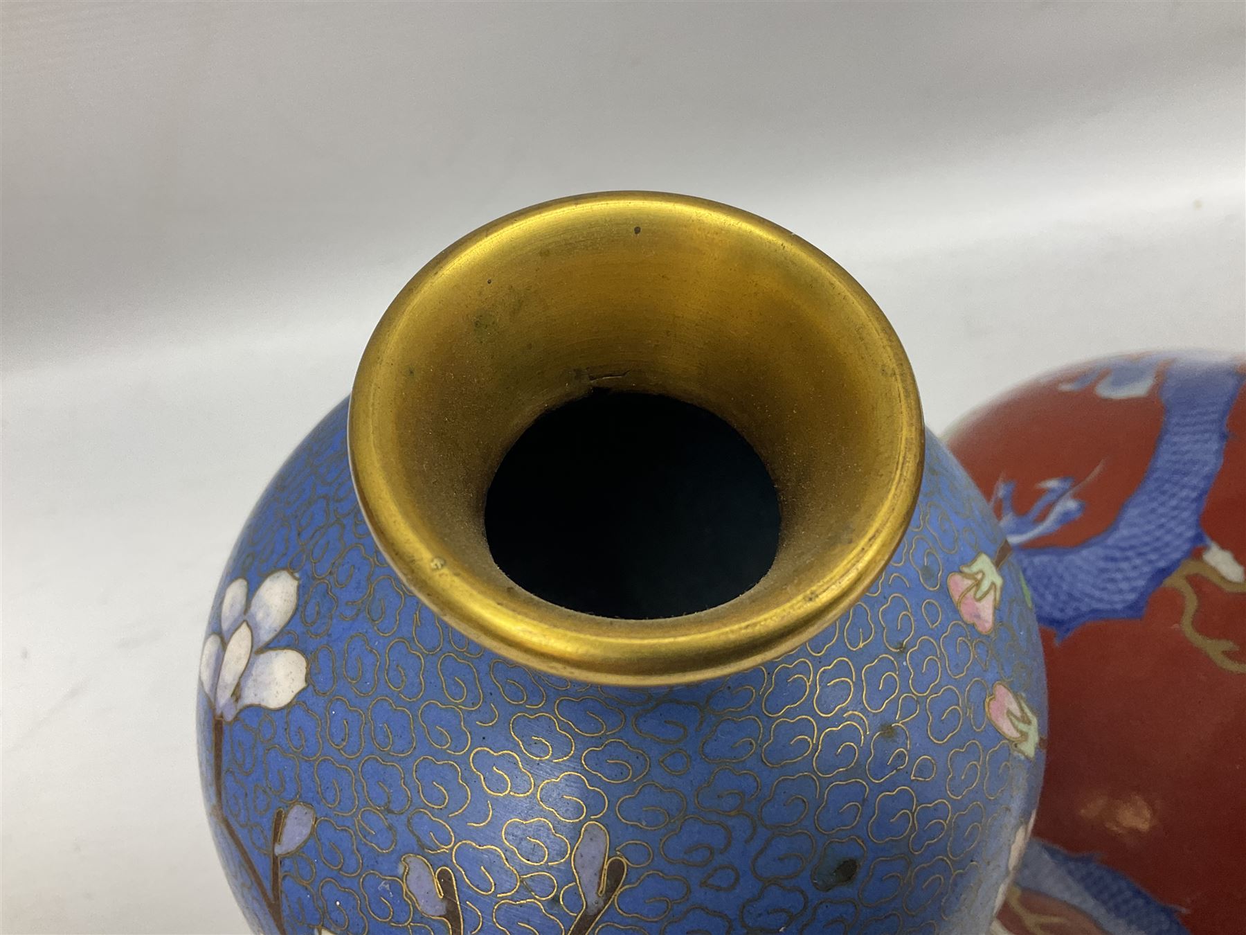 20th Century Japanese vase decorated with a blue dragon and gilding upon red yellow ground, bears Fukagawa Seiji mark (a/f), together with pair of blue cloisonné vases of baluster form decorated with blossom, and pair of Japanese vases, tallest H26cm