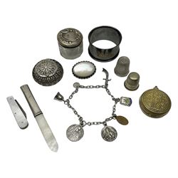 Silver napkin ring, hallmarked, together with Indian silver wirework trinket box, charm bracelet with some silver charms, pencil holder with mother of pearl page turner, etc 