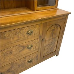 David Shackleton of Snainton - highly figured elm dresser, projecting moulded cornice over raised display cabinets and shelves, the base fitted with three central drawers and flanked by panelled cupboards, inscribed 'DS 1990'