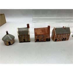 Twenty studio pottery figures of houses and cottages, comprising seventeen Mudlen End Studio Felsham Suffolk examples and two John Putman's Heritage Houses examples