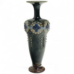 Pair of Royal Doulton stoneware vases, of baluster form with bulbous neck, with trailing white flowers and blue panel decoration, impressed mark and signature to base, 26cm (2)