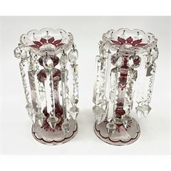 A pair of 19th century Bohemian red flashed glass lustres, each short lobed bowl supporting faceted drops, H25cm. 