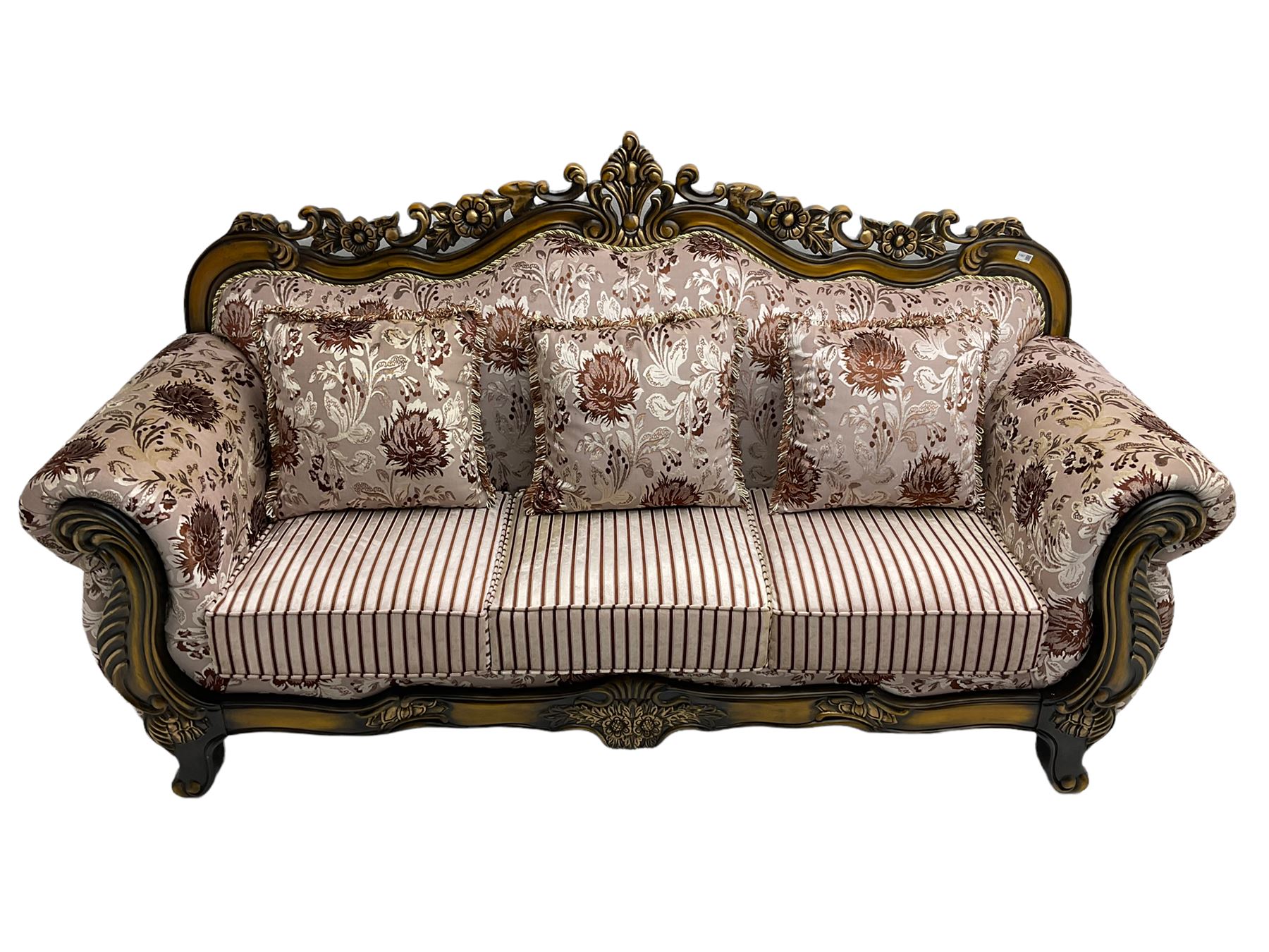 Italian Baroque design three seat sofa, hardwood framed, the cresting rail carved and pierced with c-scrolls and flower heads, scrolled arms, upholstered in floral patterned and striped fabric, with scatter cushions 