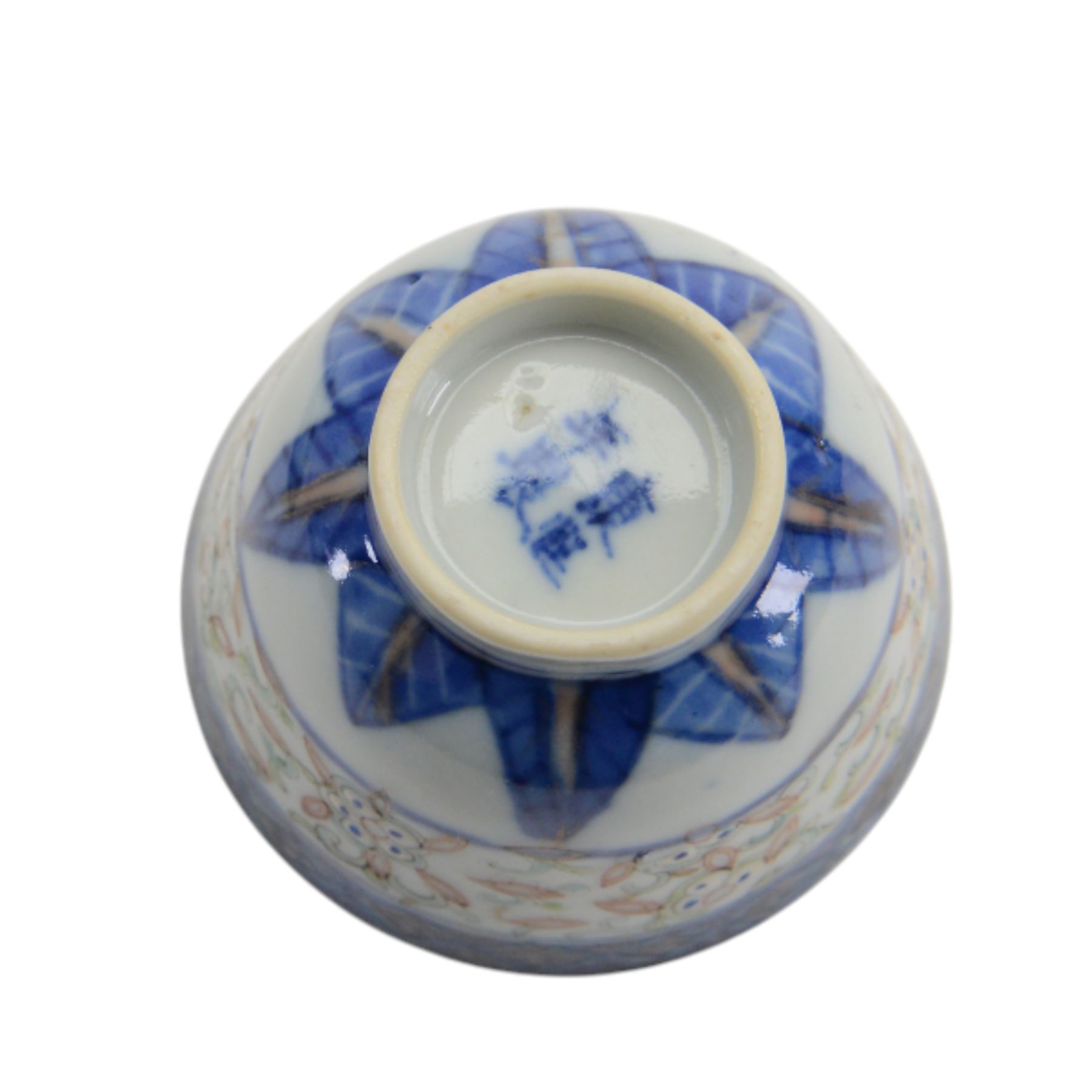 Chinese late Qing Dynasty Guangxu period rice grain detailed teabowl and saucer, each decorated in underglaze blue with flowers and foliate borders, and further detailed with iron red and pale green band of flower heads, and scrolling bands, teabowl with apocryphal Kangxi mark beneath and saucer with apocryphal Qianlong mark beneath, teabowl H5cm, saucer D10cm