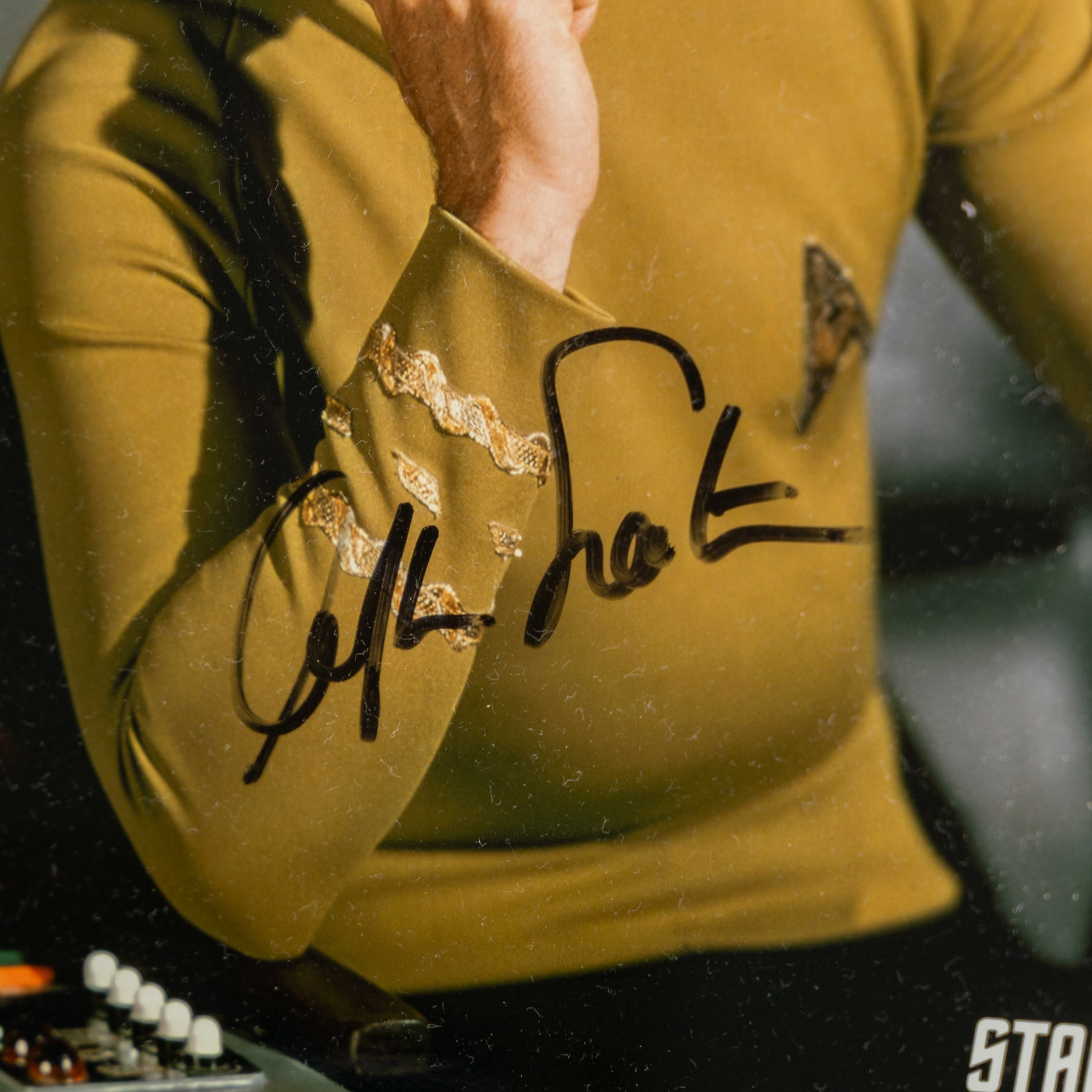 Limited edition Star Wars print 'The Voyage Begins' by Stewart Robinson numbered 516/1701, framed above three signed photographs of William Shatner as Captain James T. Kirk, Leonard Nimoy as Mr Spock and The Star Trek Legendary Four, all with certificates of authenticity verso, frame H109cm, W90cm
