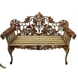 Coalbrookedale design - pair of late 19th to early 20th century 'oak and ivy' pattern cast iron garden benches, the open back decorated with trailing oak and ivy leaves, oak slatted seat, the rolled arms with hound mask terminals, on splayed and scrolled supports