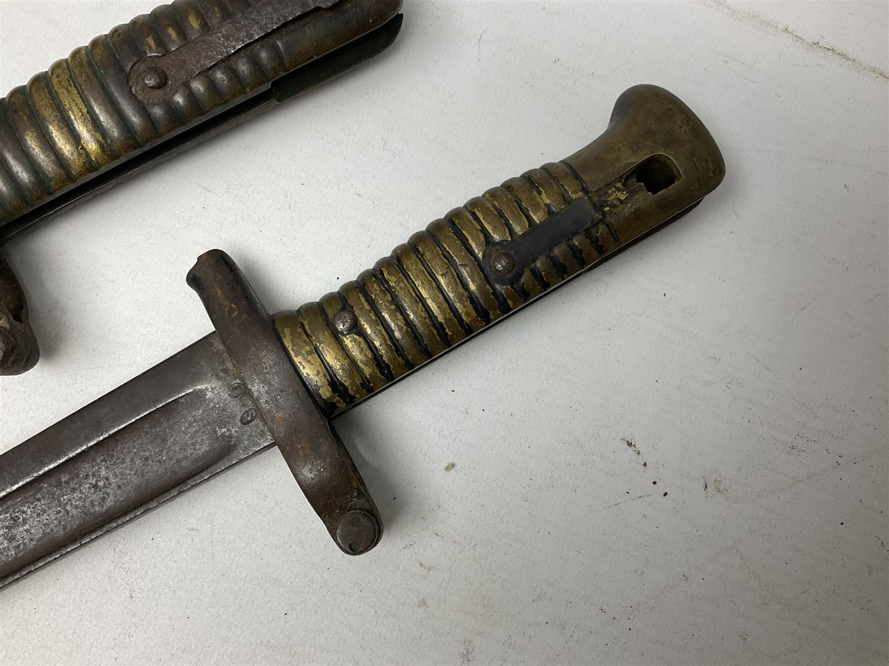 Five 19th century bayonets in relic condition without scabbards comprising British Pattern 1876 socket bayonet with Indian markings; French Model 1874 epee bayonet; and three French Model 1866 sabre bayonets (5)