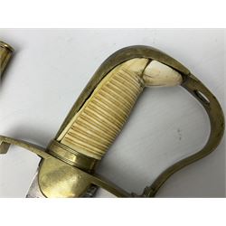 British pattern 1796 Light Cavalry Officer's sword, the 83.5cm curving steel blade marked 'W. Parker London' and 'Warranted' verso, brass stirrup hilt with half-round langets, knucklebow and backstrap with ribbed ivory grip; in brass mounted leather covered scabbard with two suspension rings L97cm overall. This item has been registered for sale under Section 10 of the APHA Ivory Act 