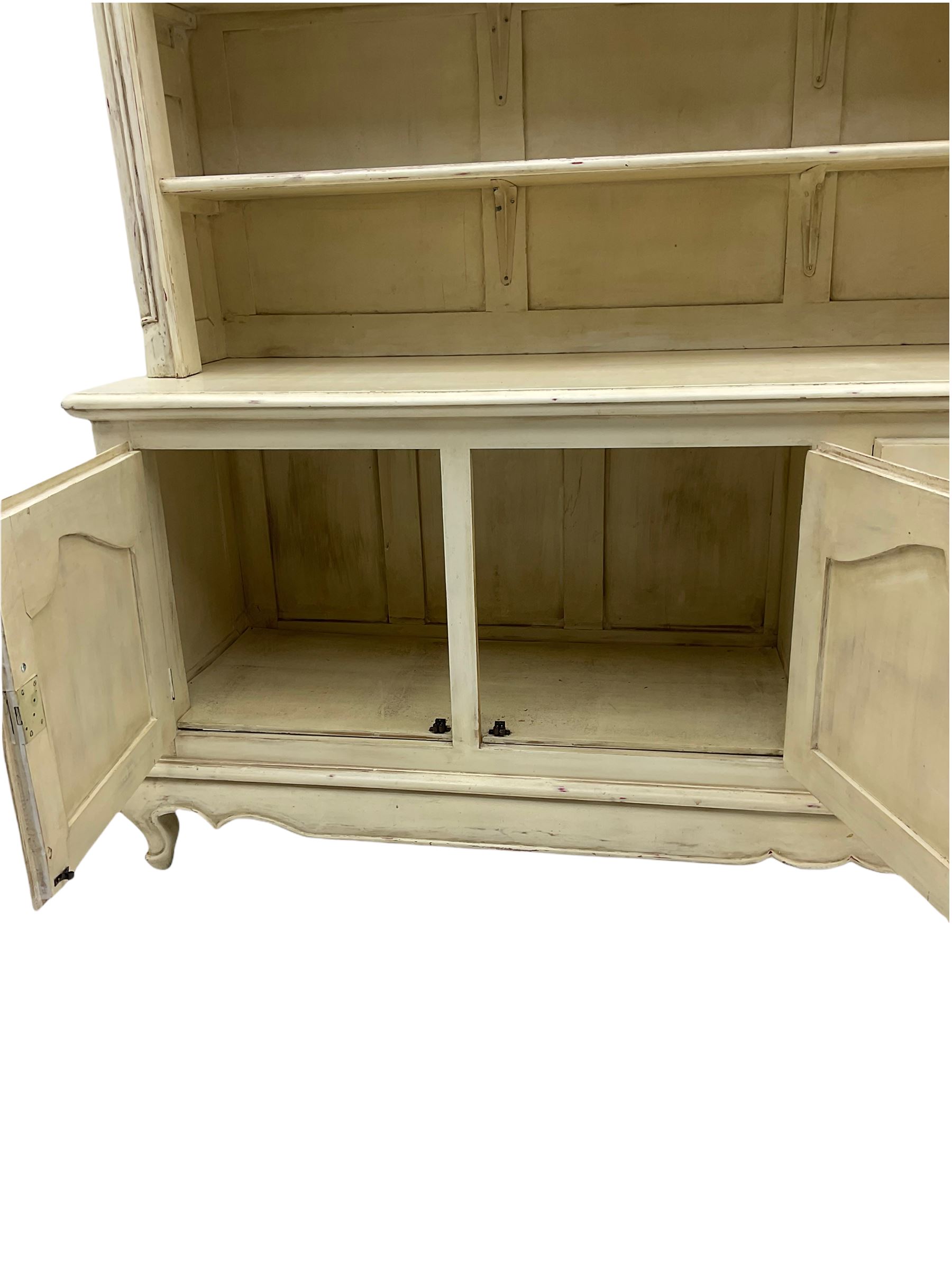 Large French style cream painted dresser, fitted with four cupboards and three tier plate rack