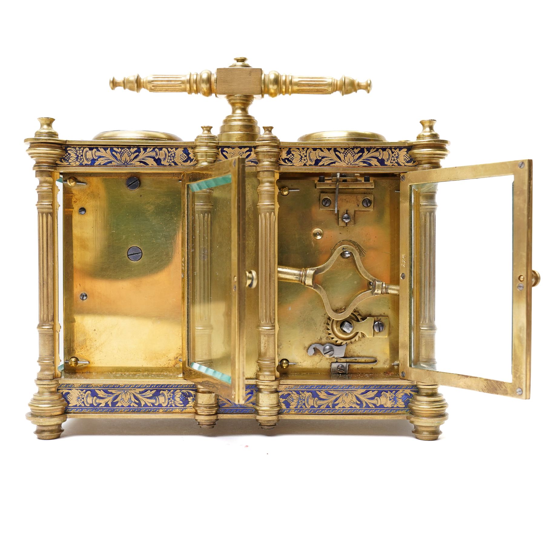 French-late 19th century combination brass carriage timepiece with barometer, thermometer and compass, with a fluted T bar handle and eight matching columns with turned finials, bands of fretted brass to the base and cornice and conforming decoration to the dial masks and dial centres, with silvered chapters to the time dial and barometer and a mercury thermometer between, the top with a circular bevelled viewing glass to the escapement and compass to the other, with a single train 8-day movement and cylinder platform escapement.  With key.