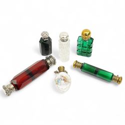 Victorian ruby glass double ended scent flask with white metal covers, another in green, t...