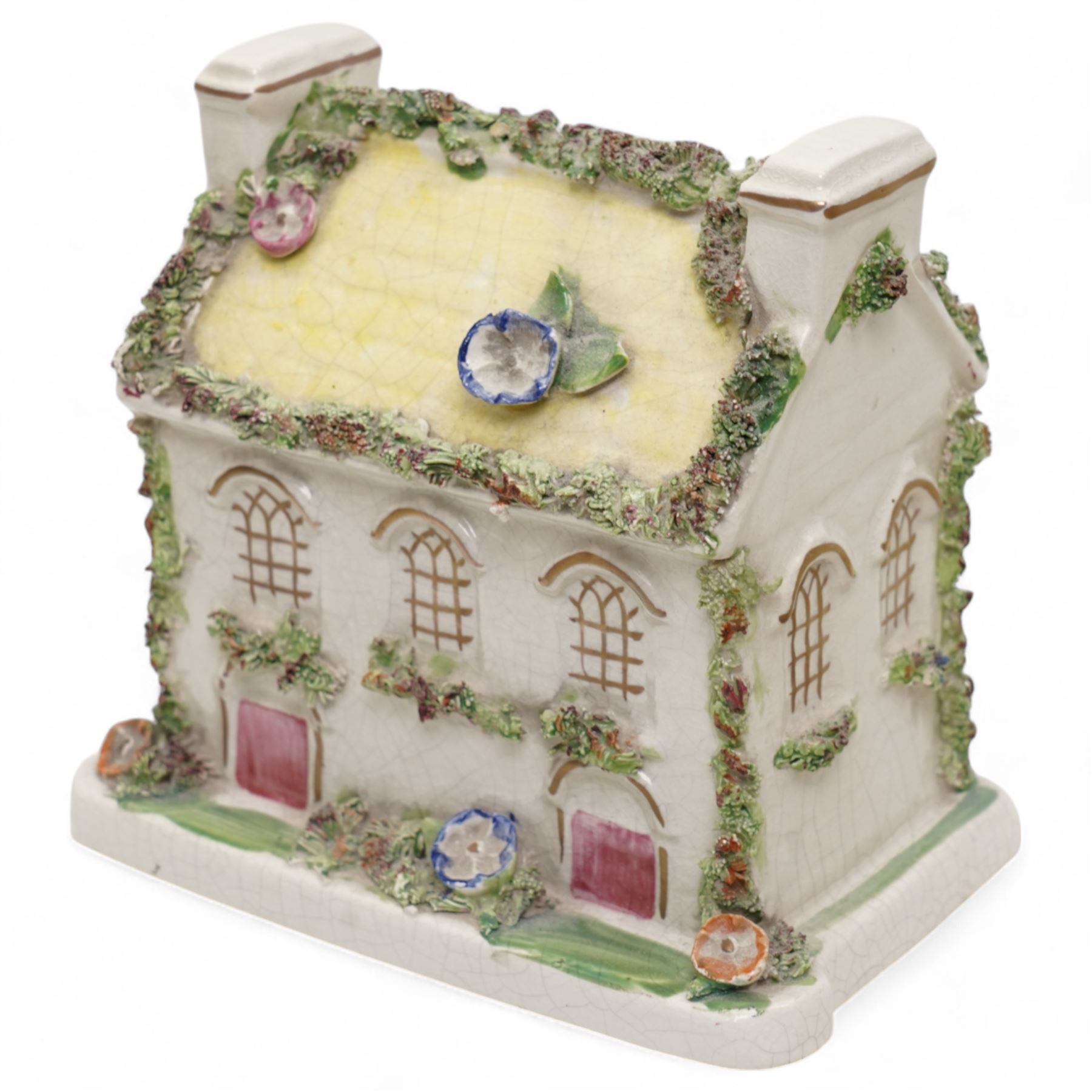 19th century pottery money box in the form of a two storey house with applied floral decoration W14cm  and six pottery cottage pastille burners