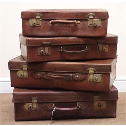  Four graduating vintage leather suitcases, hinged lid with clasp, W61cm, H17cm, D39cm (maximum)  