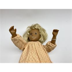 Sasha Morgenthaler vinyl doll, the girl's head with painted blue eyes and lips and short blonde hair, the jointed body donning a peach floral dress with matching underclothes, unmarked, H41cm