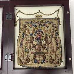 Continental petit point evening bag, with enamel and pearl details, in wooden display frame, together with a snake skin handbag and three other vintage bags