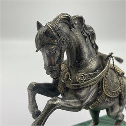 Modern silver model of a rearing horse, with ornate parcel gilt saddle and bridle, mounted upon a rectangular base, decorated with malachite panels to each side and upon four gilt bun feet, horse stamped 925, overall H14.5cm