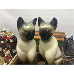 Pair of tall Siamese cats, together with a recumbent example, horse and caravan, three doorstops including Laurel and Hardy example, etc