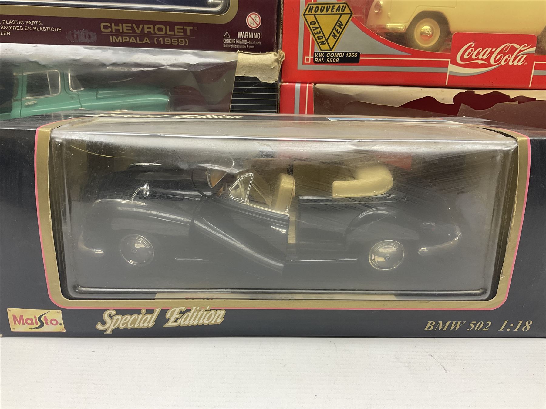 Seven 1:18 scale die-cast models by Ertl, Road legends, Maisto, Solido etc including two Coca Cola promotional vehicles; five boxed (7)