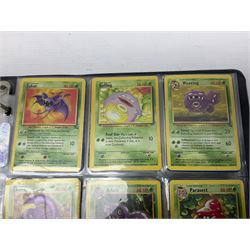 Collection of Pokemon trading cards, mostly 1999 Wizards Pokemon cards to include holo Charizard 4/102, first edition holo Machamp 8/102, further holographic cards; Dark Flareon 35/82 and Dark Vaporeon 45/82, cards from themed sets and 4th edition prints; 1998 Electronic Pokédex with cardboard boxes for themed decks Blackout, Overgrowth and Power Reserve Jungle, along with a large quantity of energy and trainer cards 