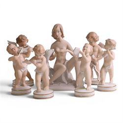 Seven Wallendorf figures, including Young woman with deer 1754, four putti with musical in...