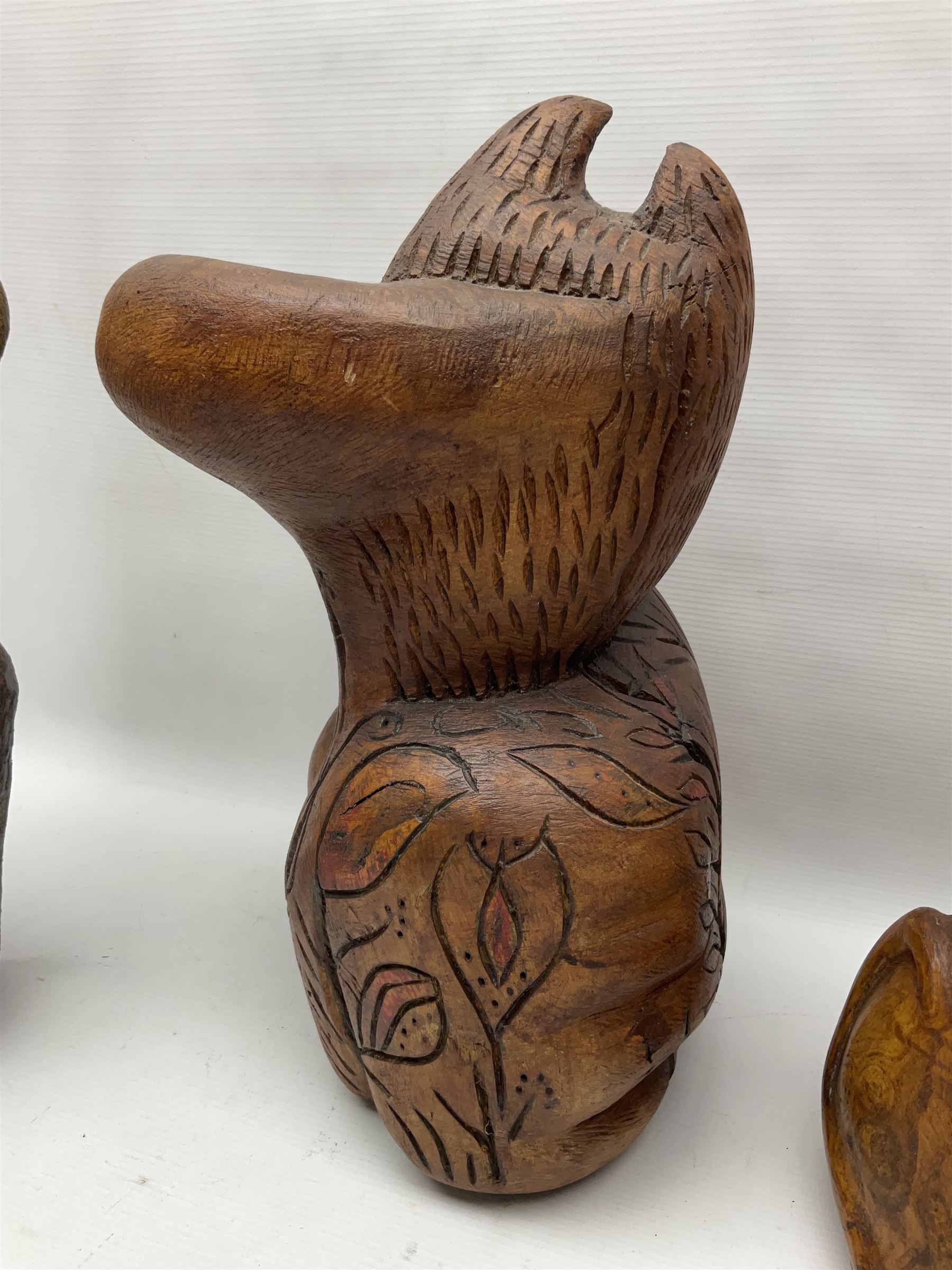 Helen Skelton (British 1933 – 2023): Three carved wooden abstract sculptures, each modelled as a cat, with carved or painted features, largest H63cm. Born into an RAF family in 1933 in Kent and travelled the world extensively during her childhood. After settling in Bridlington, Helen immersed herself in painting, textiles, and wood sculpture, often inspired by nature's beauty. Her talent was showcased in a one-woman show at Sewerby Hall and recognised with the sculpture prize at Ferens Art Gallery in 2000. Sadly, Helen’s daughter passed away from cancer in 2005. This loss inspired Helen to donate her sculptures to Marie Curie upon her passing in 2023.