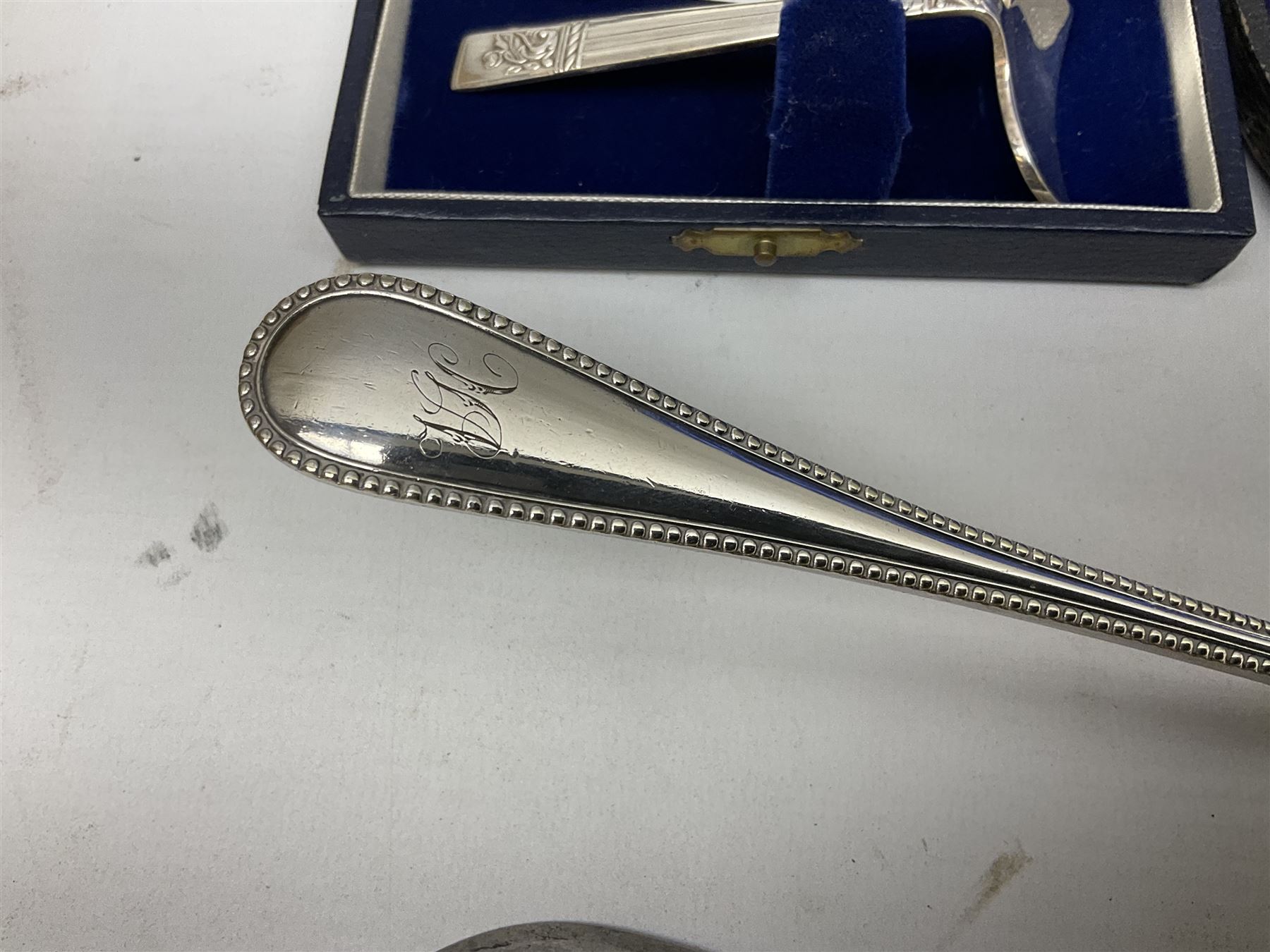 Cased pair of Wedgwood silver-plate book stands, silver-plate baby feeding spoon and pusher in box, other silver-plated cutlery