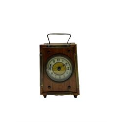 An American “Jerome” late 19th century  30-hour spring driven steeple clock with alarm, in a mahogany case with a decorative glass tablet depicting a rose painted white dial with roman numerals and minute track, steel moon hands and a brass alarm setting disc to the centre. With pendulum and key.
H40 W20 D10
With a small portable 19th century German “Wutternberg” alarm clock, the piece dial with a gilt centre and Ivorine chapter ring, Arabic hours and minute band, wooden case with brass fittings and carrying handle on four feet, wound and set from the rear with integral keys, alarm sounding on a bell. 
H20 W12 D7
