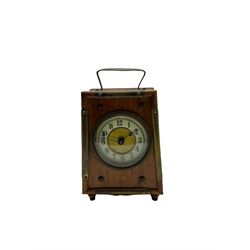 An American “Jerome” late 19th century  30-hour spring driven steeple clock with alarm, in a mahogany case with a decorative glass tablet depicting a rose painted white dial with roman numerals and minute track, steel moon hands and a brass alarm setting disc to the centre. With pendulum and key.
H40 W20 D10
With a small portable 19th century German “Wutternberg” alarm clock, the piece dial with a gilt centre and Ivorine chapter ring, Arabic hours and minute band, wooden case with brass fittings and carrying handle on four feet, wound and set from the rear with integral keys, alarm sounding on a bell. 
H20 W12 D7

