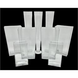 Four large glass vases, of tapering rectangular form, together with a similar smaller pair and three tall tapering cylindrical glass vases, tallest H57cm (9)
