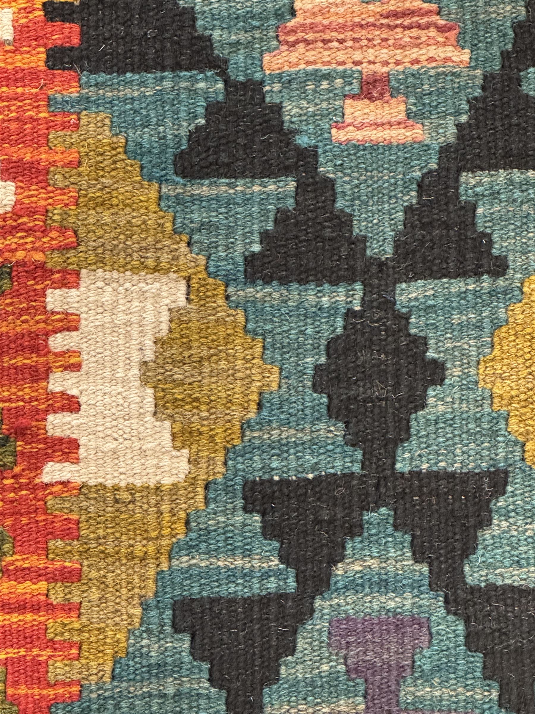 Afghan Maimana Kilim flatweave runner, handwoven with a teal ground featuring a bold multicoloured diamond-lattice design, enclosed by stylised border motifs, finished with fringed edge