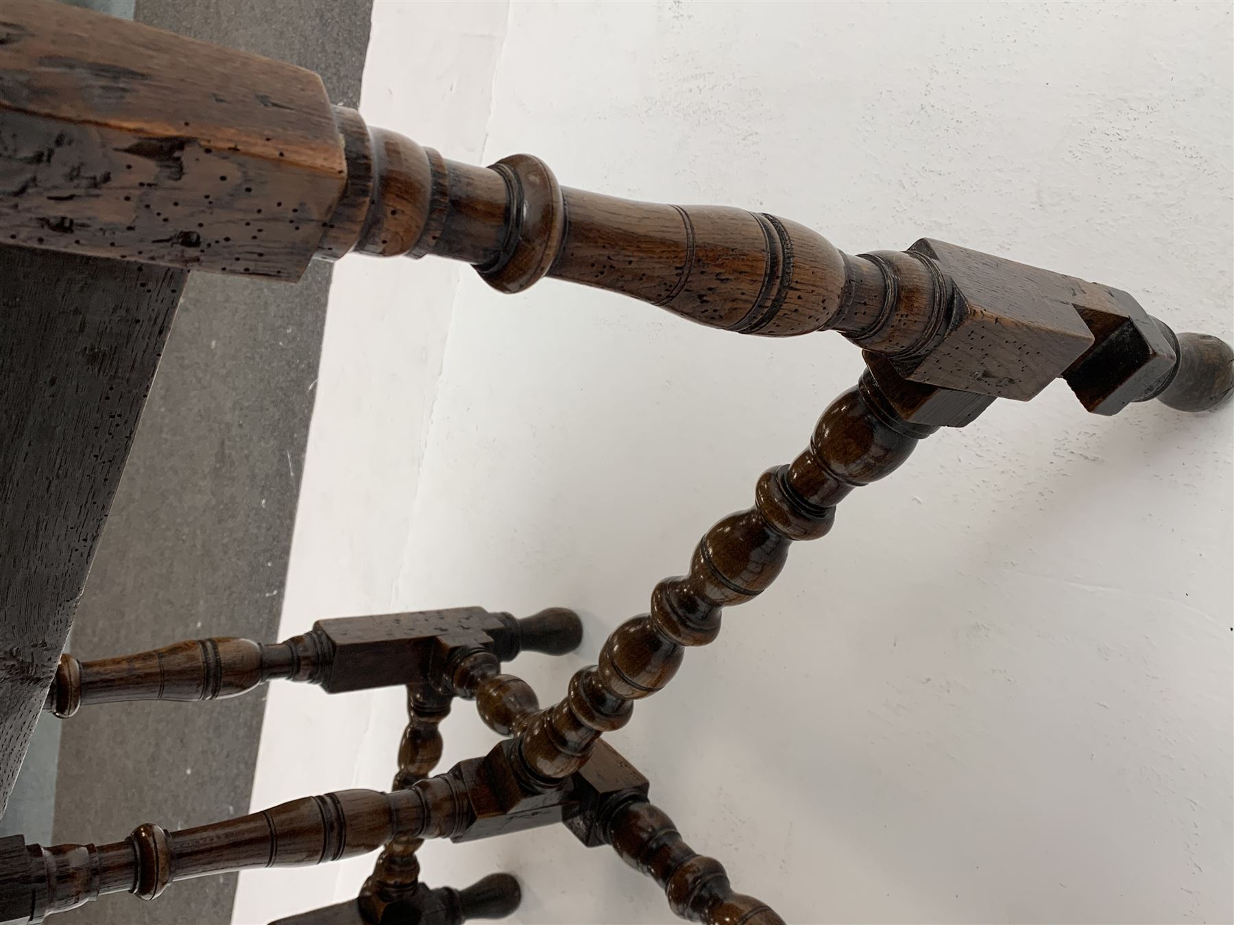 Late 17th century William & Mary oak drop leaf dining table, oval drop leaf top, single drawer to one end, gate action base, turned supports joined by bobbin turned stretchers, 121cm x 135cm, H75cm (open)