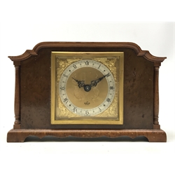  Elliott mahogany and burr wood architectural cased mantle timepiece, the gilt metal Roman dial with winged mask head spandrels and silvered chapter ring, eight day movement H14cm  