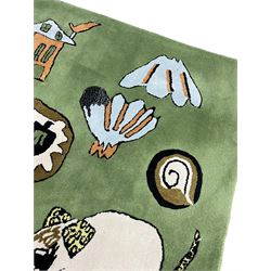 Shrimps for Habitat - 'Wilder' hand tufted green ground rug decorated with abstract motifs of animals, faces, shells and houses 