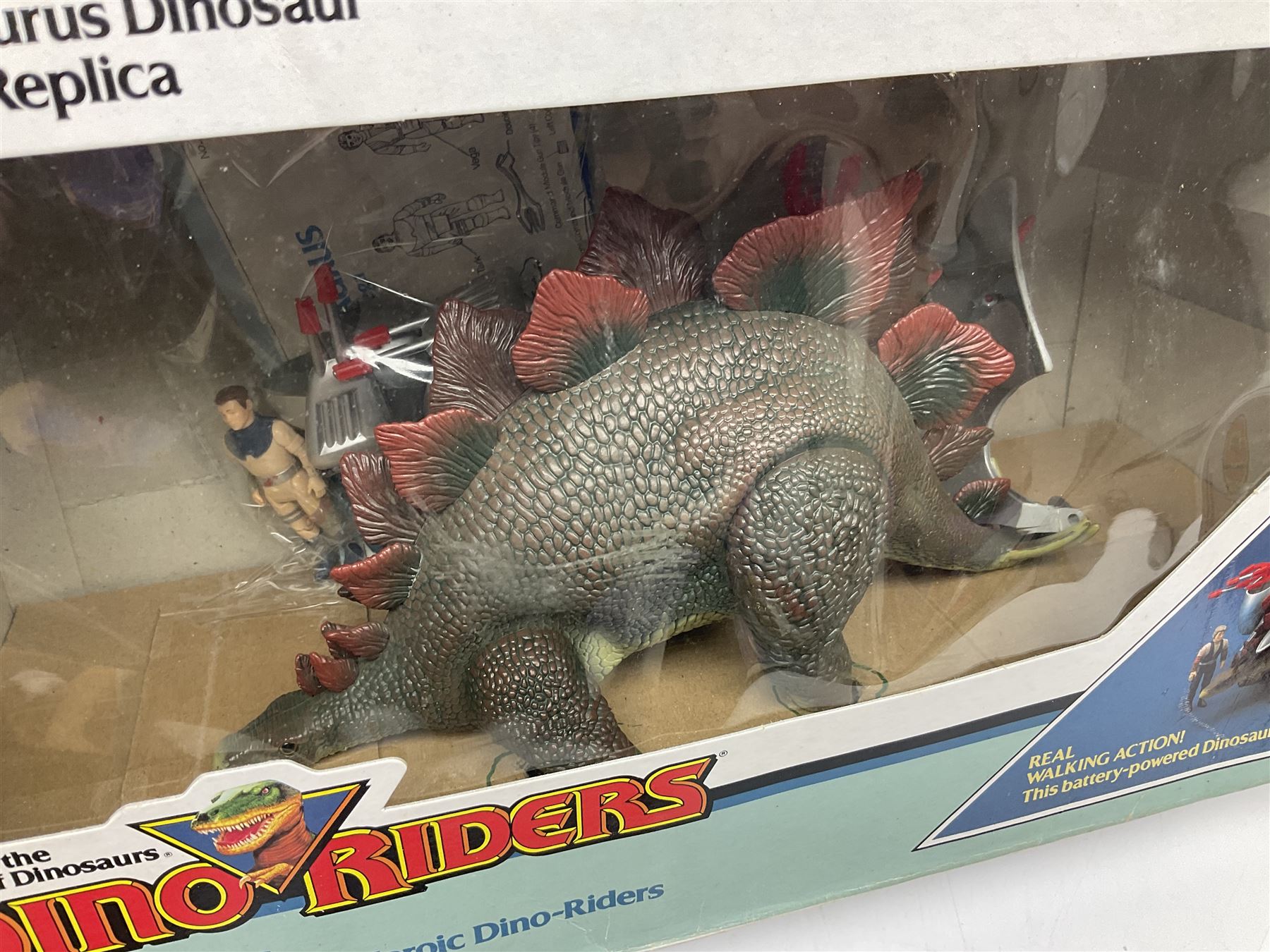 Dino-Riders 1980s by Tyco Action-GT, Stegosaurus with Tark and Vega Heroic Dino-Riders; Triceratops with Hammerhead and Sidewinder Evil Rulon Warriors; and Struthiomimus with Nimbus Heroic Dino-Rider; all boxed; two Action Figures, re-bagged on original card backing; and two VHS video tapes (6)