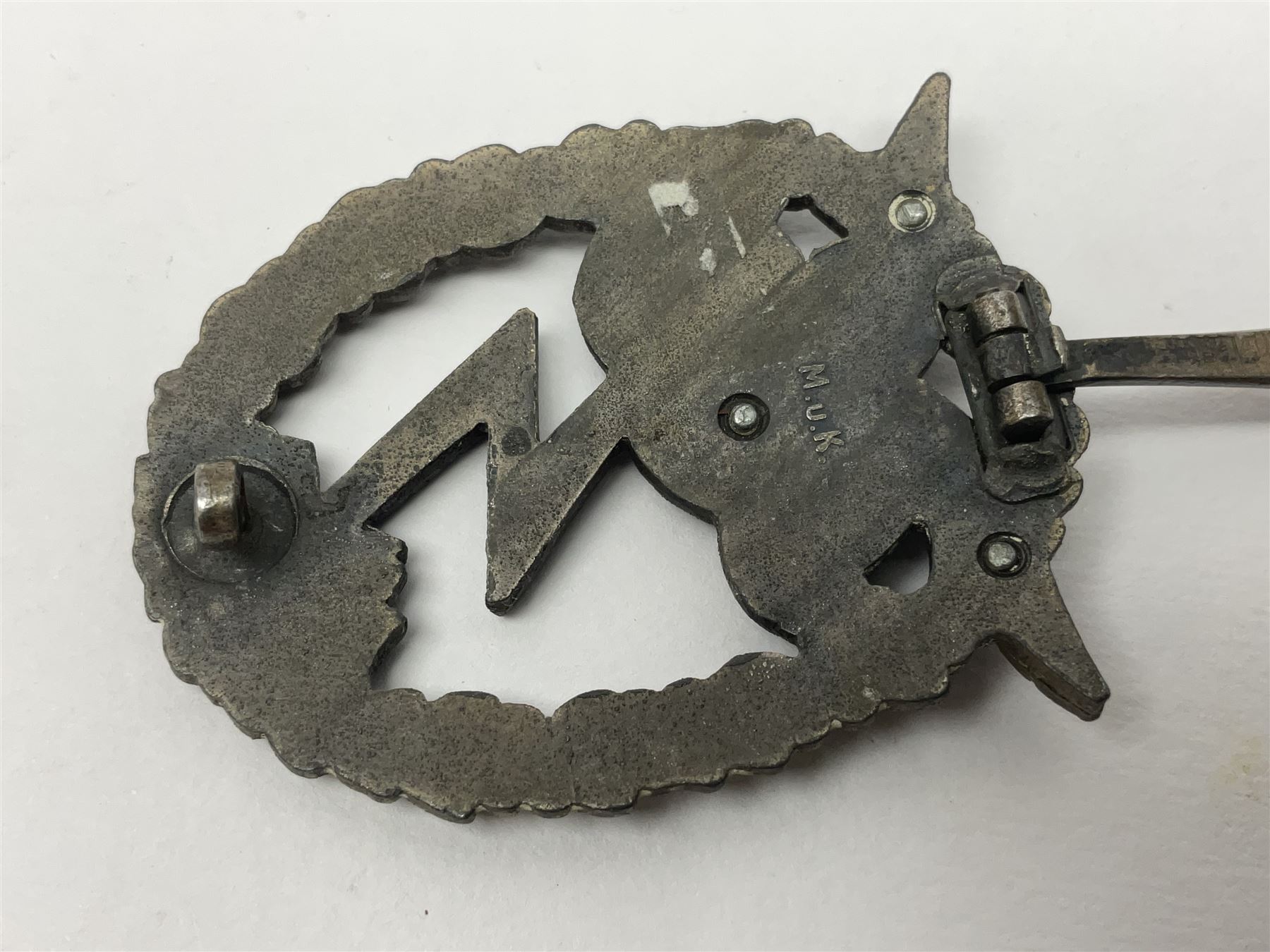 Two WW2 German Luftwaffe Ground Assault/Combat badges - one with flat pin and maker's mark M.u.K.; the other unmarked with round pin (2)