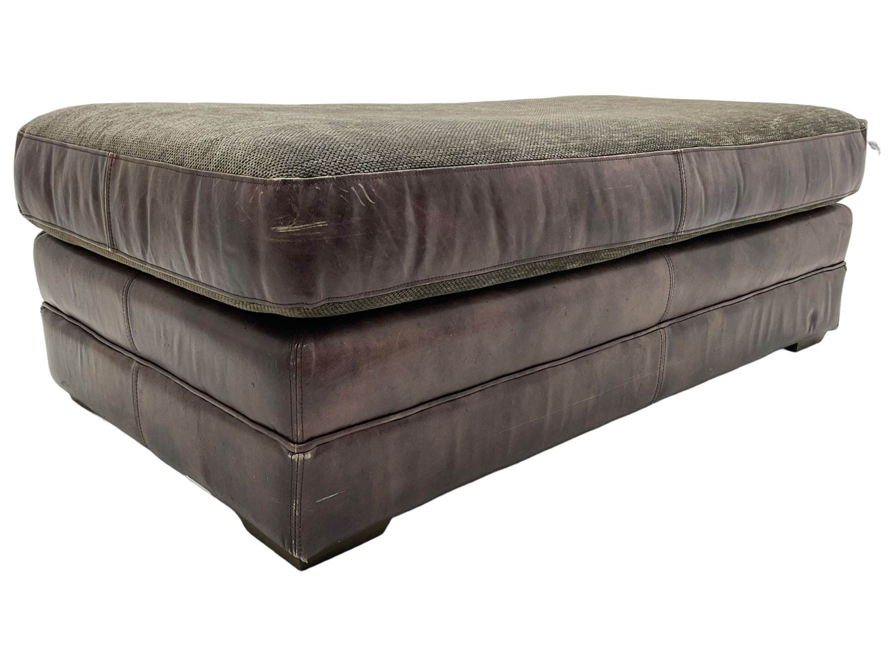 Large Knole design three-seat sofa upholstered in brown leather with scatter cushions upholstered in contrasting striped and Union Jack patterned fabric, on block feet (W210cm, H100cm, D102cm); together with matching rectangular footstool (135cm x 75cm, H45cm)