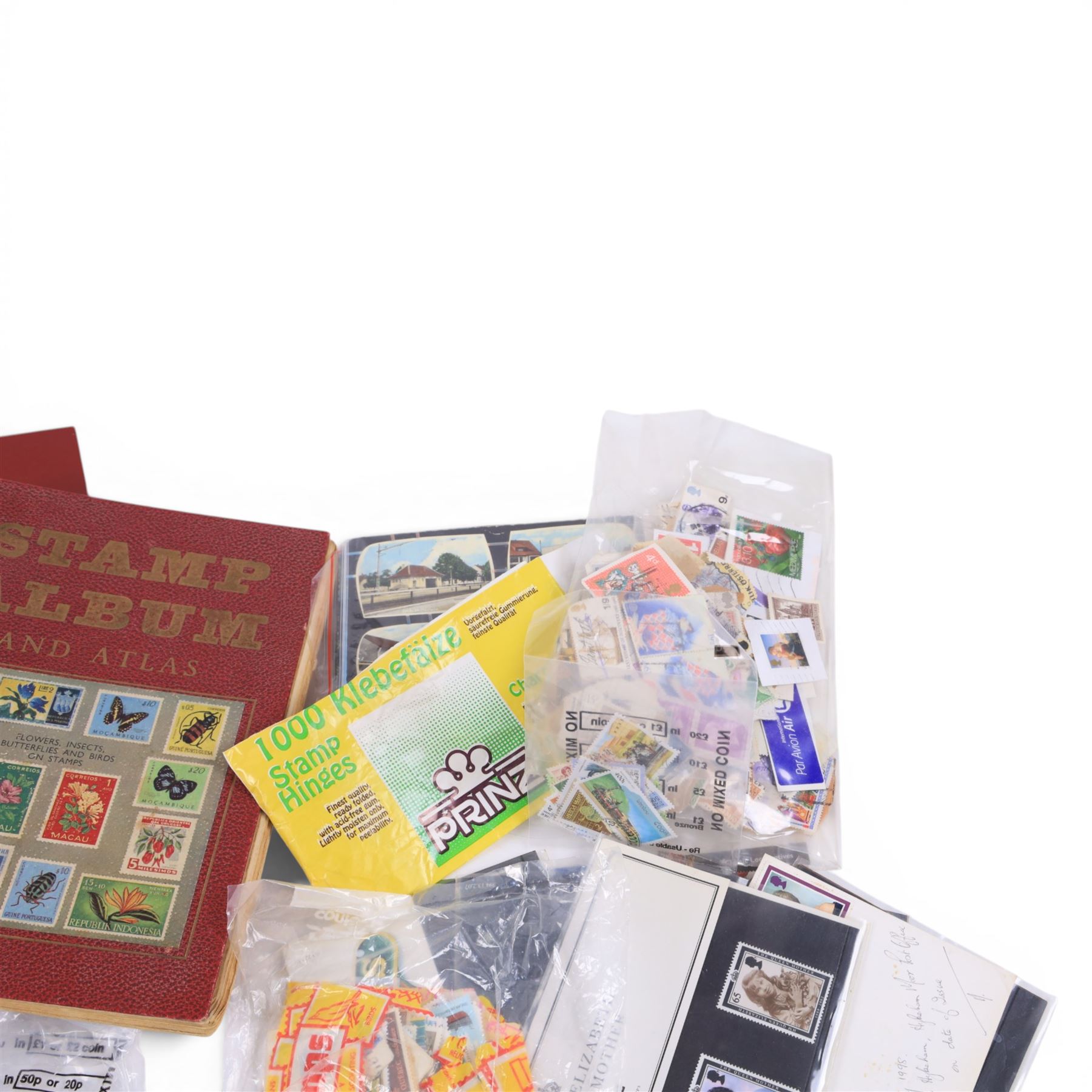 Great British and World coins and stamps, including commemorative two pound and fifty pences, commemorative crowns, loose stamps, etc, in one box