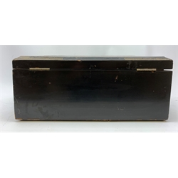  A 20th century Chinese black lacquer and gilt detailed writing box, decorated with figures, pagodas and cranes amidst a mountainous landscape, the hinged cover opening to reveal a compartmented interior and fold out baize lined slope, H20cm L46.5cm D31.5cm.   